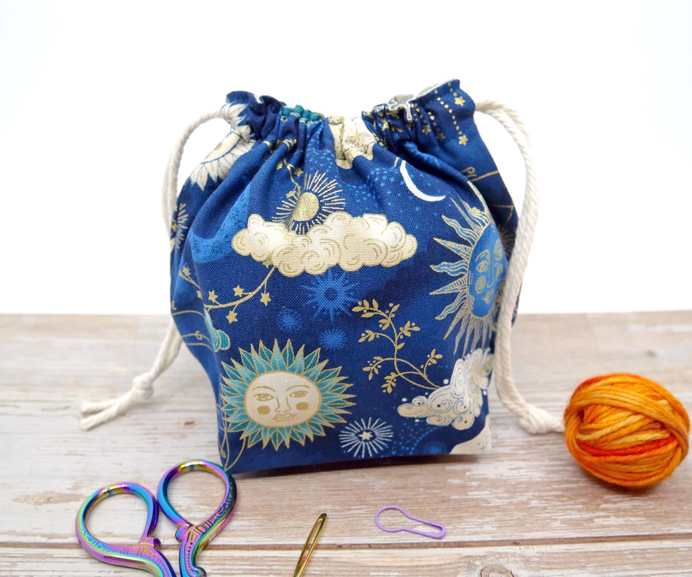 navy and gold celestial sun moon and stars drawstring pouch for knitting and crochet yarn bowl