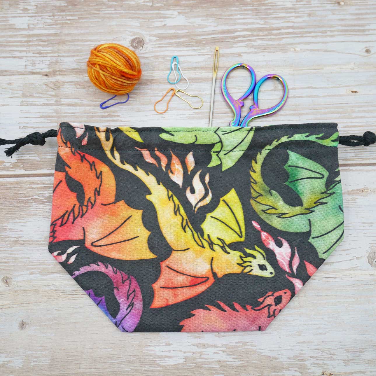 fabric yarn bowl dragon dice swords rainbow knitting or crochet project bag