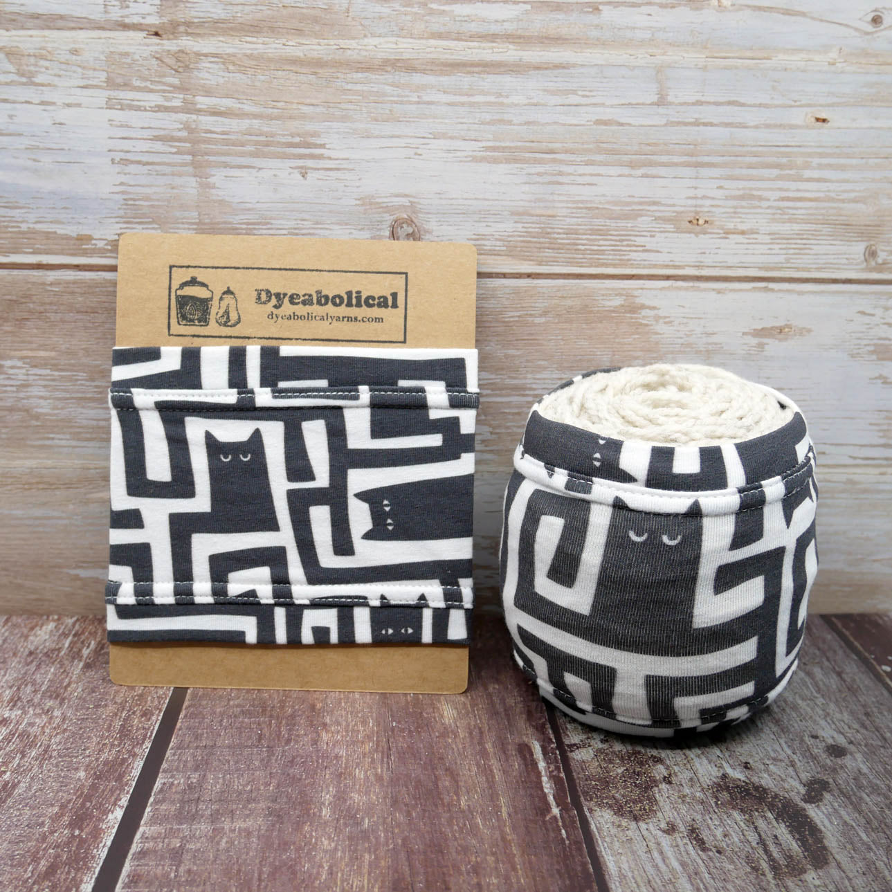 black and white stylized cat yarn sleeve
