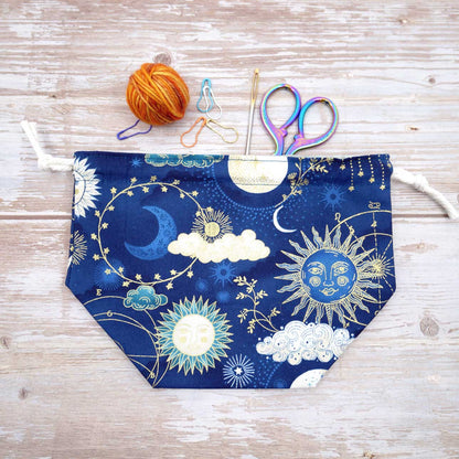 navy and gold celestial sun moon and stars drawstring pouch for knitting and crochet yarn bowl
